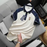 Chỗ sỉ áo Thun Polo Nam Phối Màu Và In Hình Gấu Trước Ngực BigSize Từ 50-90kg
