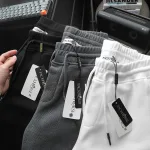 Quần short nam vải thun thêu logo chữ, size 50-80kg