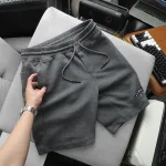 Quần short nam vải thun thêu logo chữ, size 50-80kg